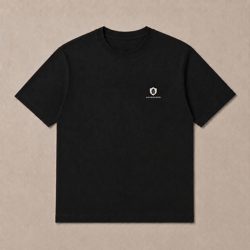Front of a black Oakenford T-shirt with small logo