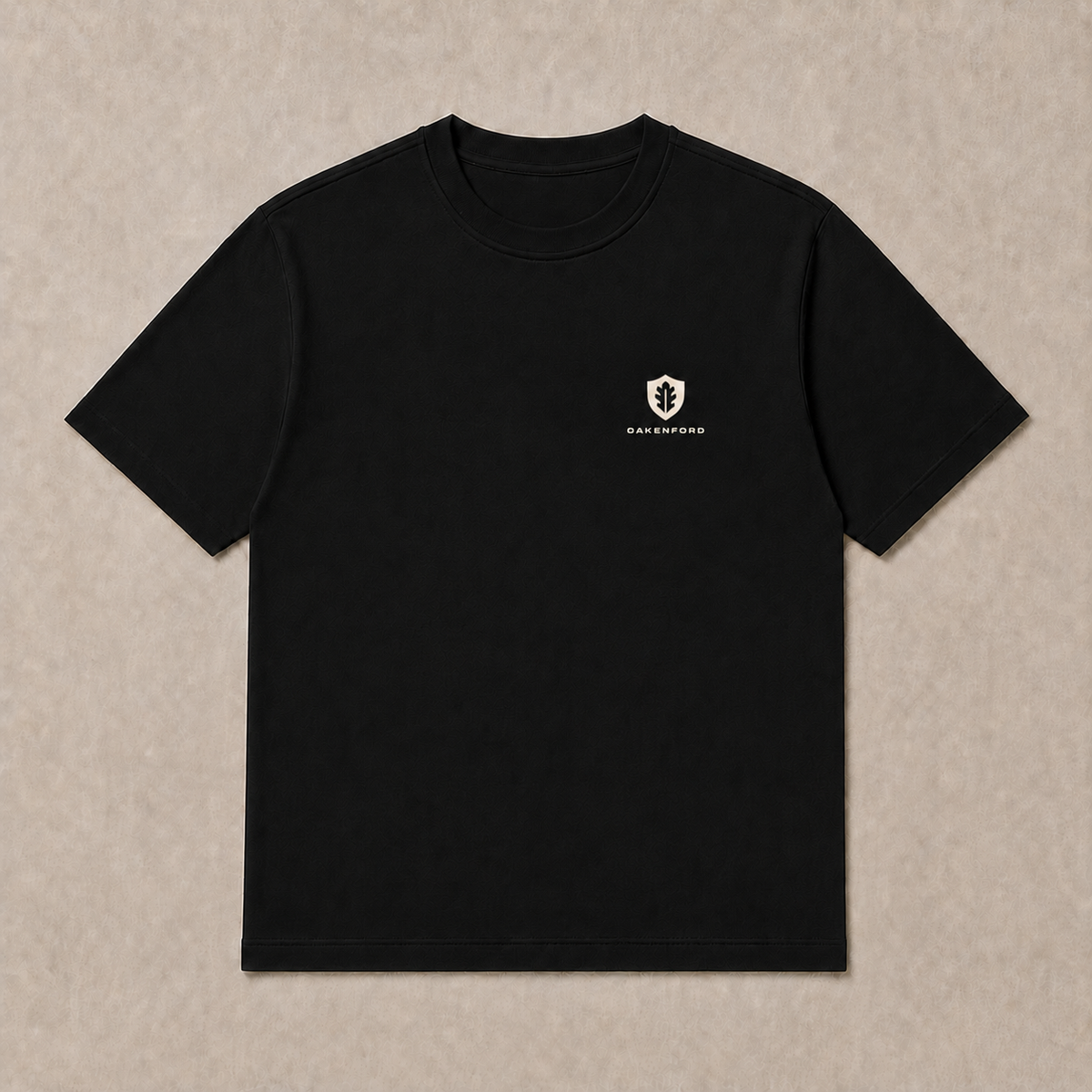 Front of a black Oakenford T-shirt with small logo