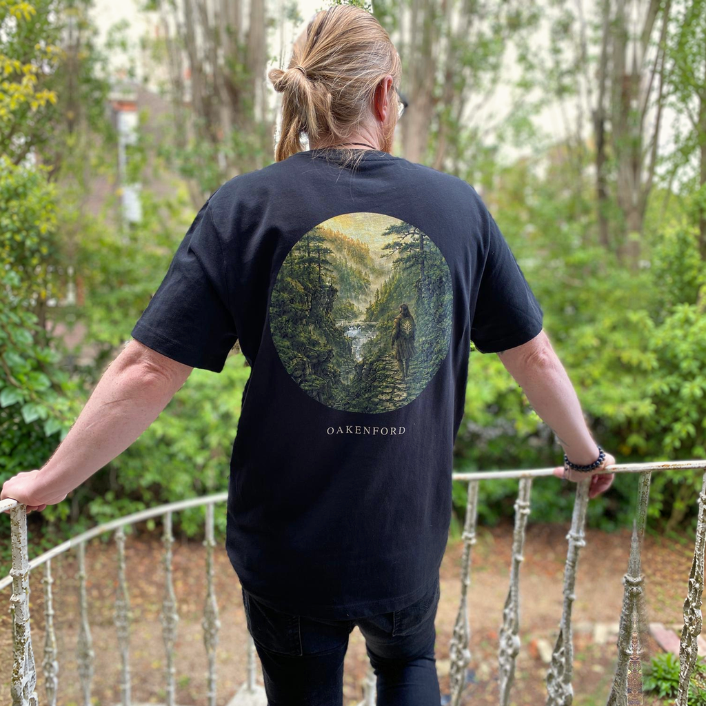 Model wearing the Green Divide Oakenford graphic T-shirt