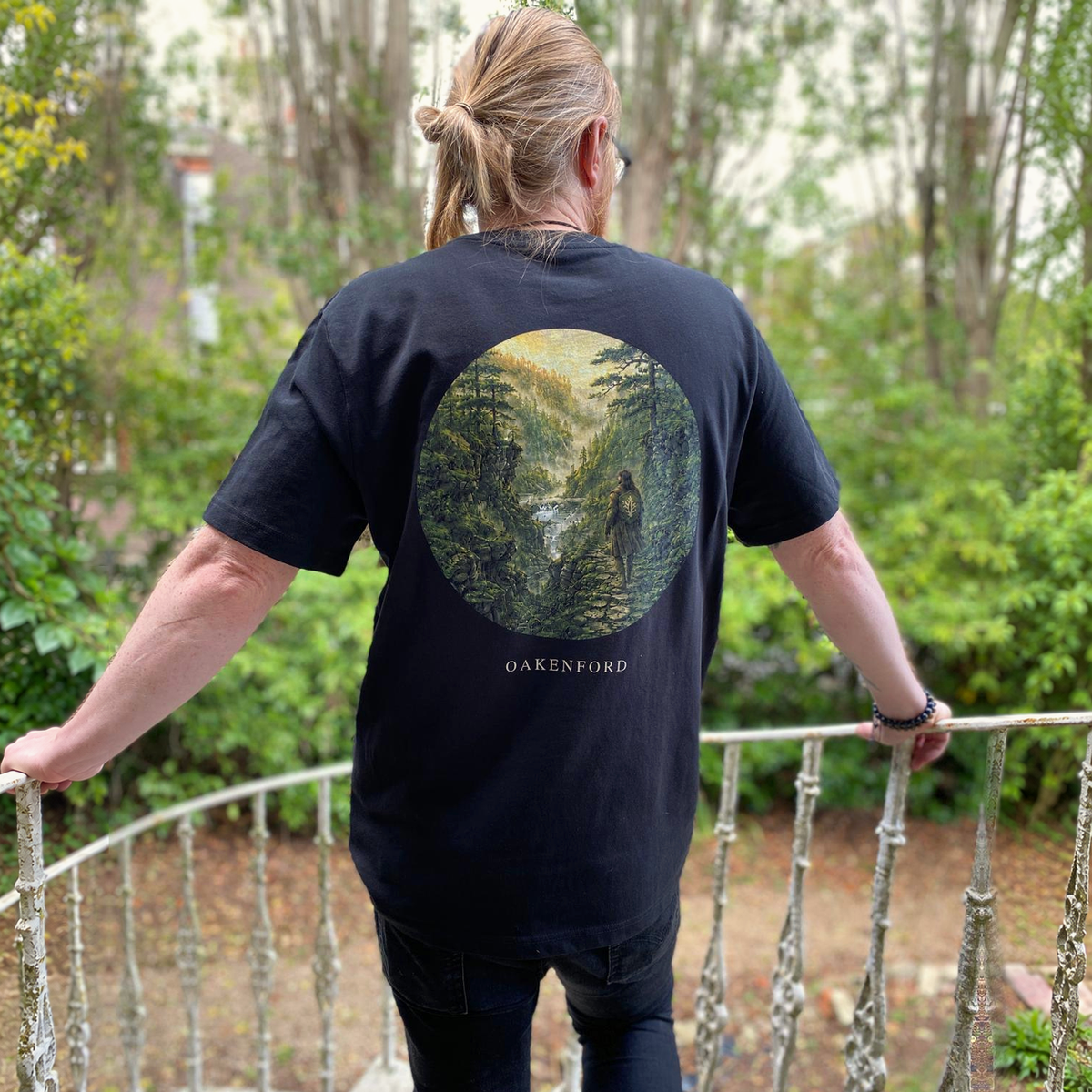 Model wearing the Green Divide Oakenford graphic T-shirt