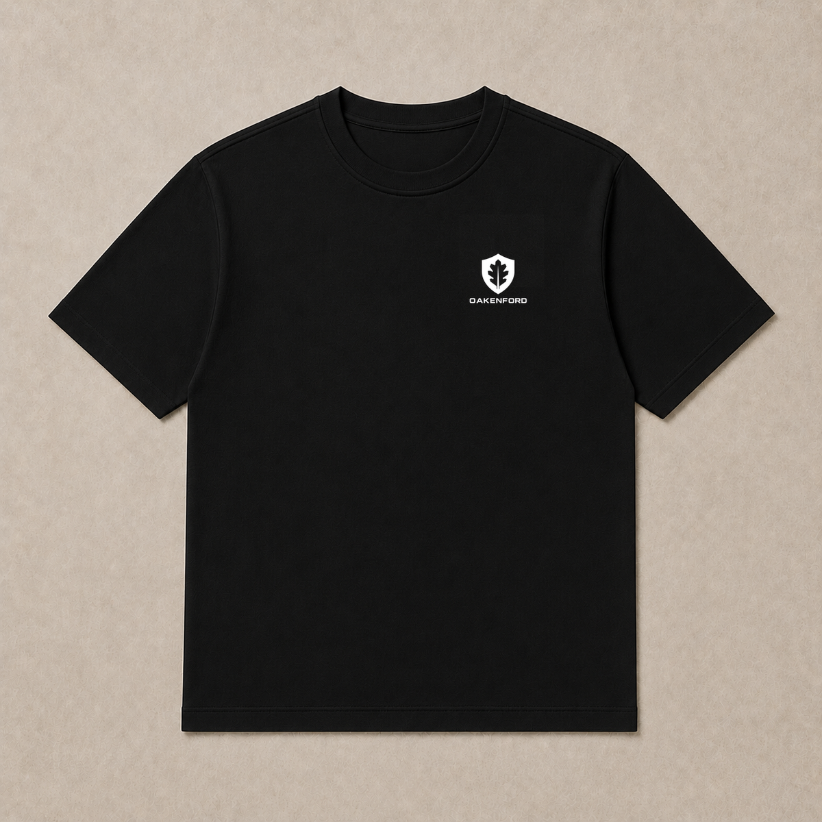 Front of a black Oakenford T-shirt with small logo