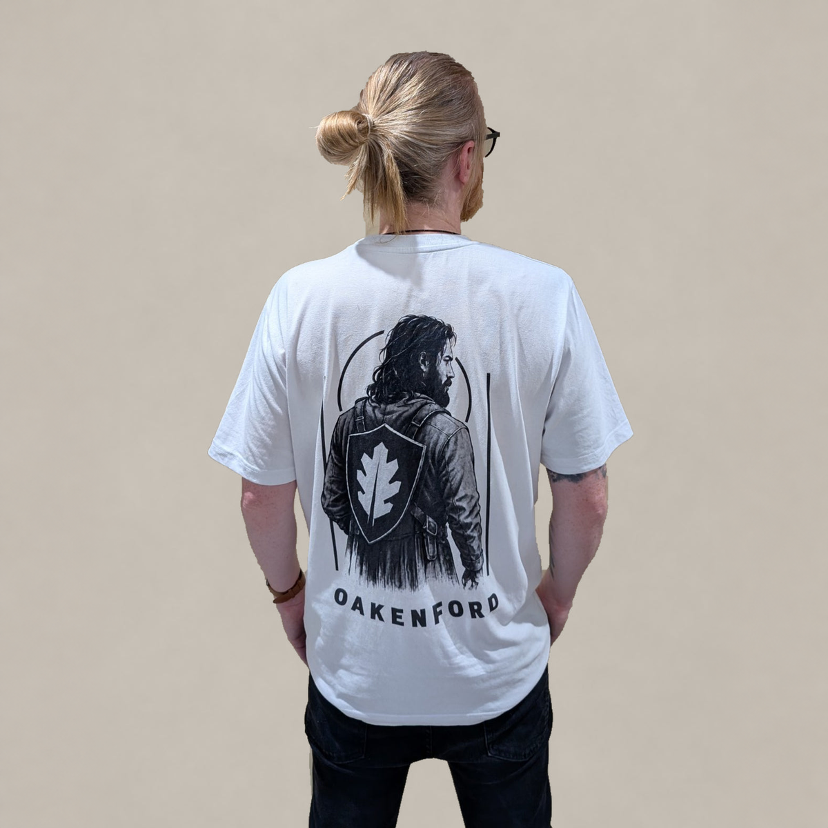 Model wearing the white Shield Bearer T-shirt, rear view.