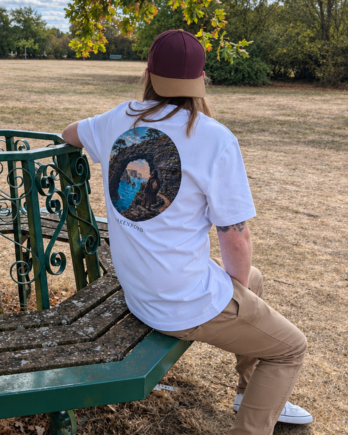Stone Current white tee worn on a park bench